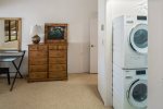 Stacked washer and dryer off the master bedroom